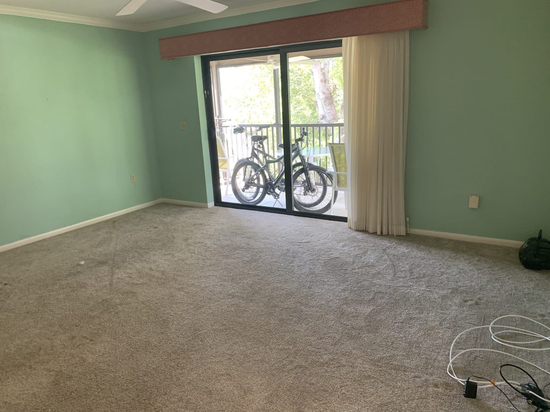 Empty living room with balcony access