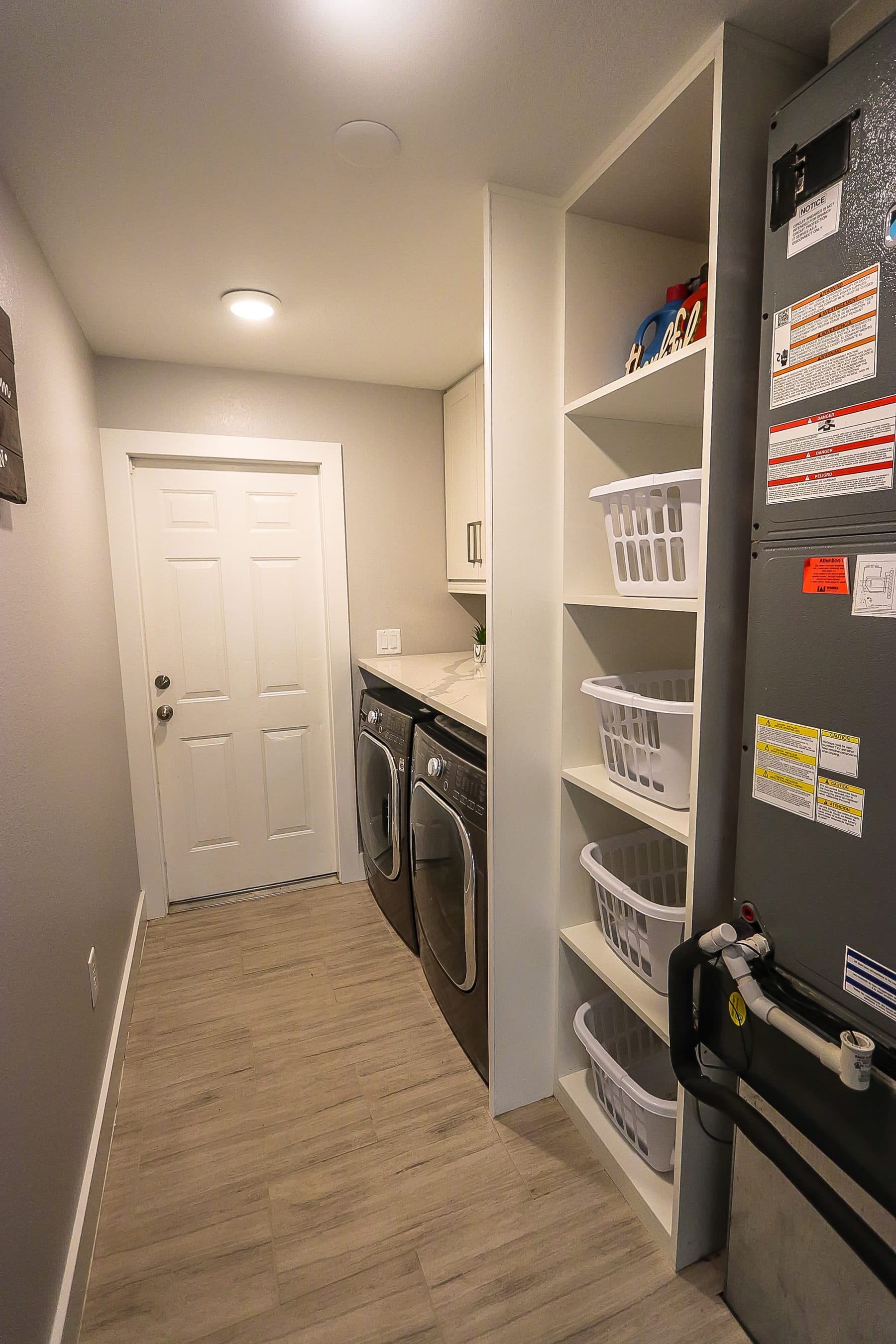 Organized laundry room storage closet